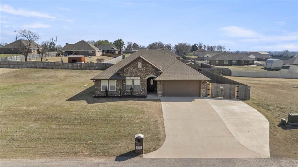 An overshot view of a single family home on a spacious lot provides a prime example of the Stillwater OK real estate situation. Beautiful homes in high demand
