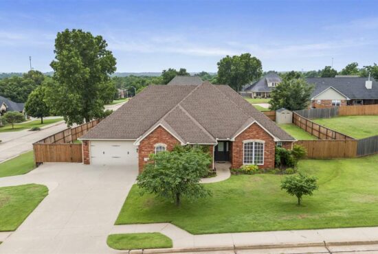 A beautiful single family home on bright green lawn plot supporting an article for the cost of living in stillwater ok